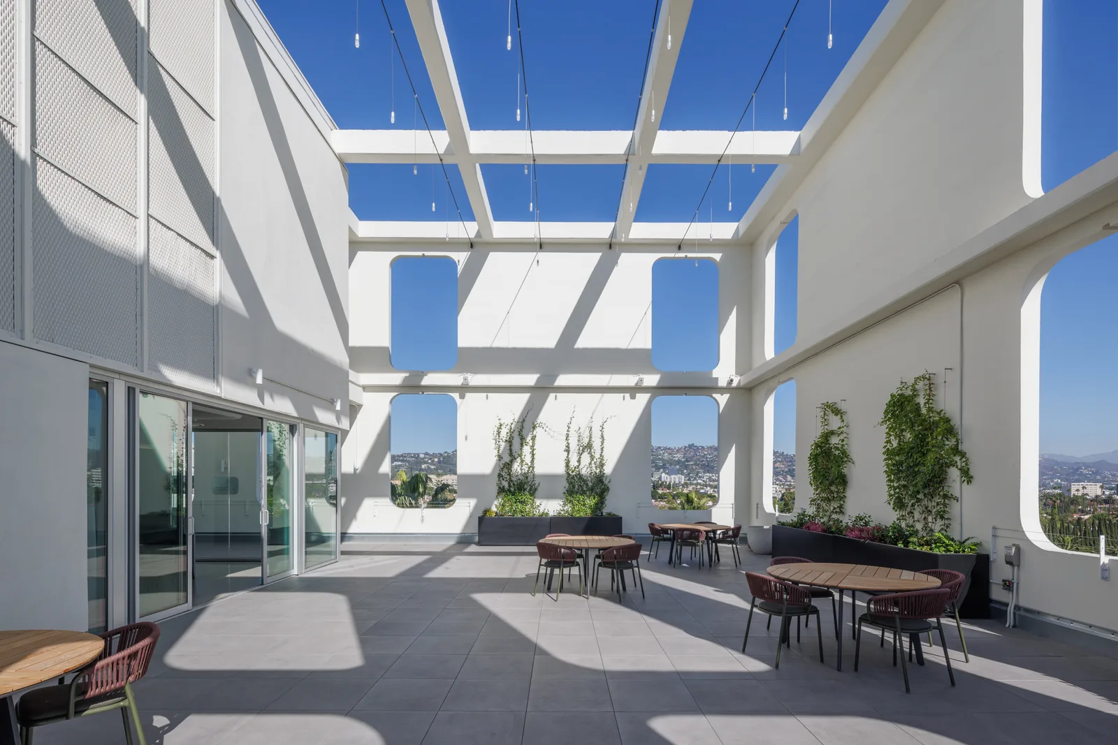 Terrace seating with sun flare and city view