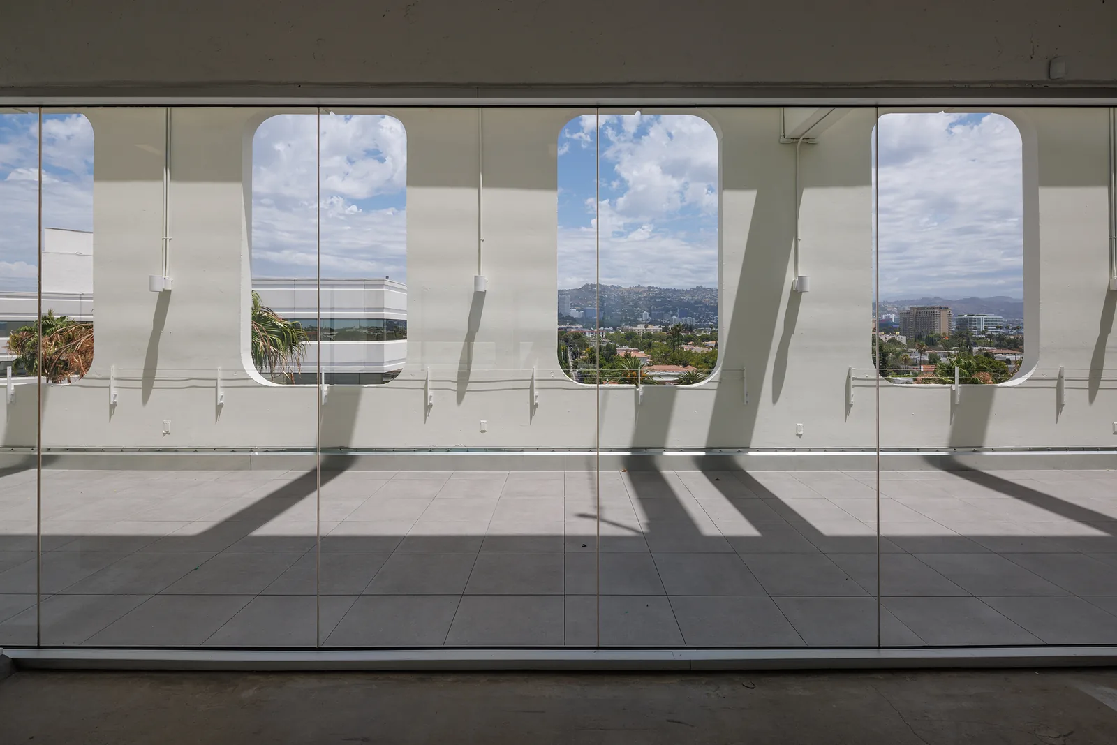 Indoor event room with porthole windows framing the view