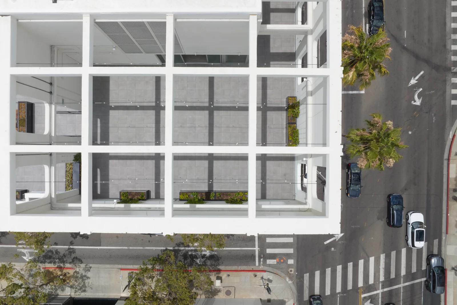 Aerial view of the rooftop and Beverly Hills streets below